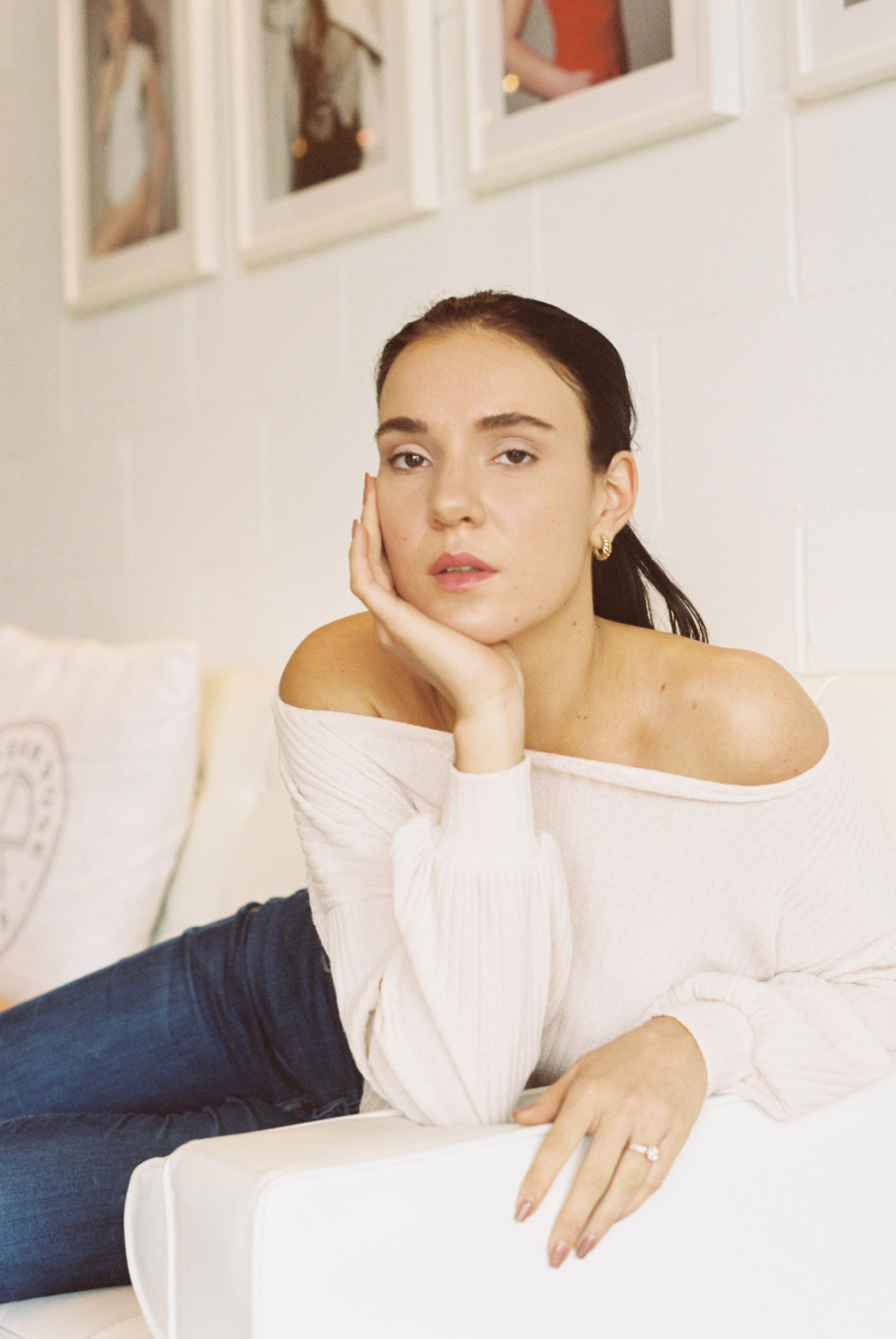 Seated indoor film portrait in soft window light
